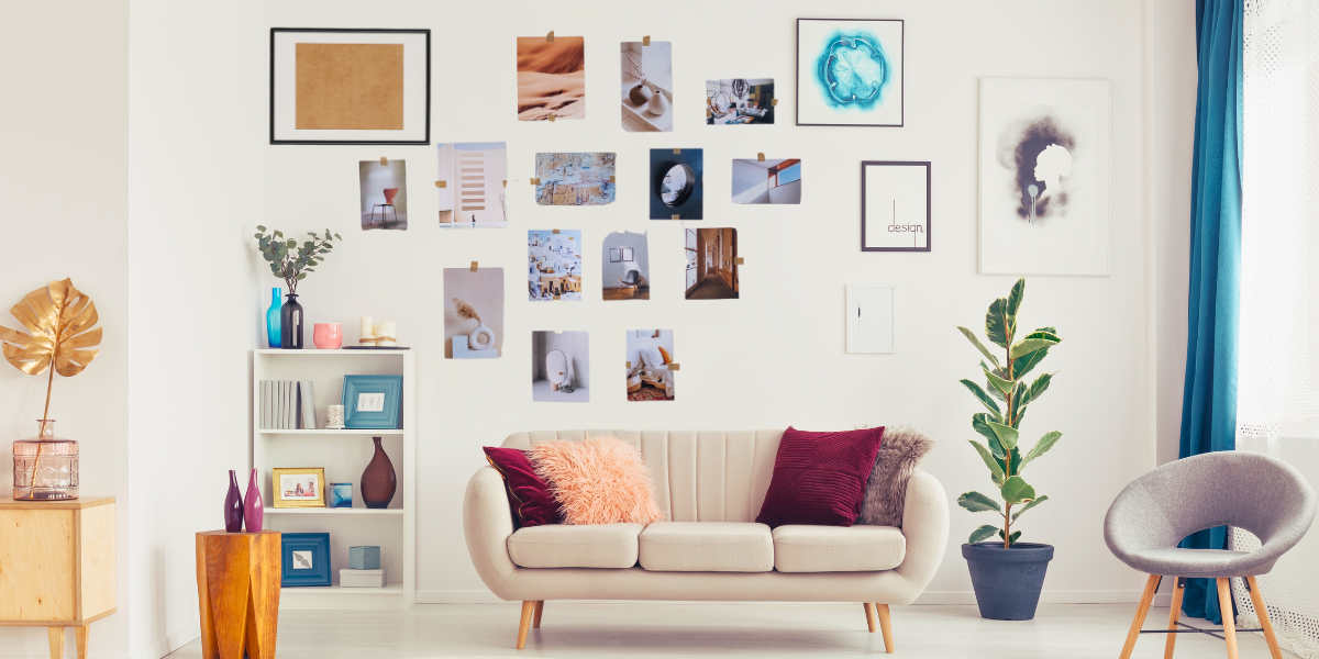 A living room with a gallery wall decorated with photos and artwork. 