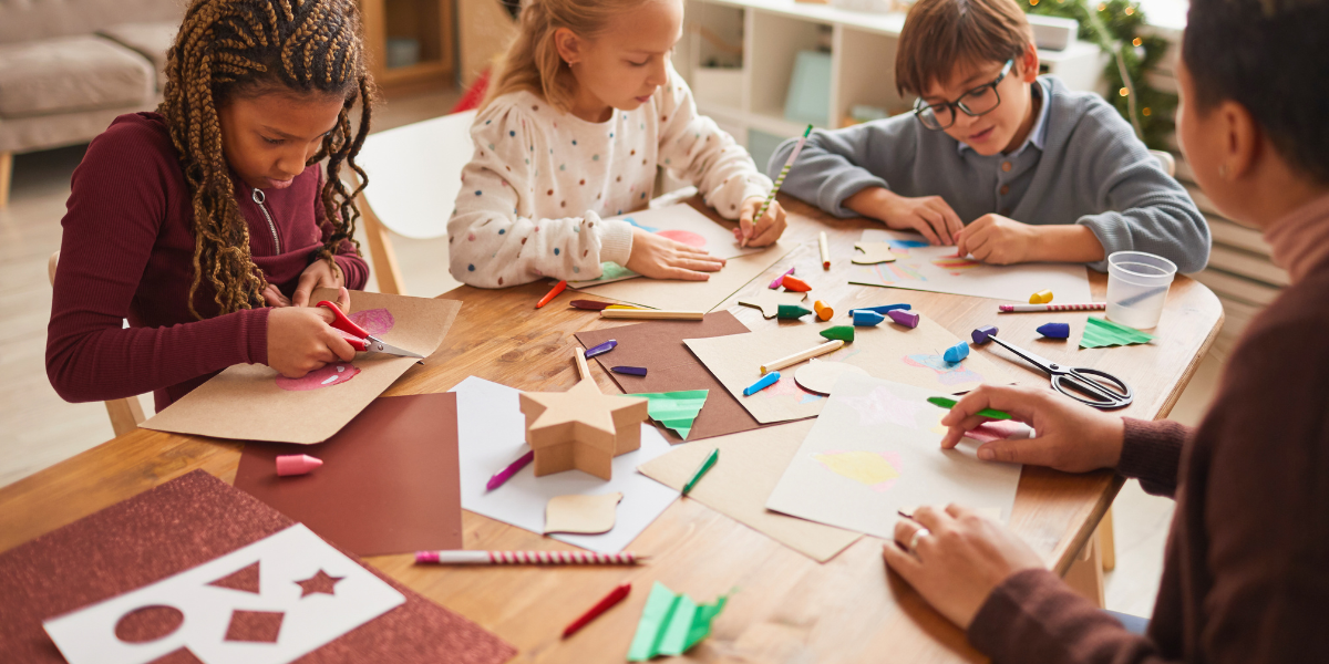 Family doing arts and crafts together at a table.