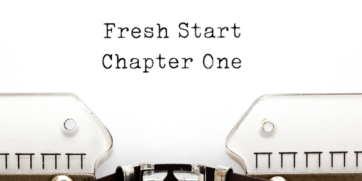 Type writer showing the words "Fresh Start Chapter One"