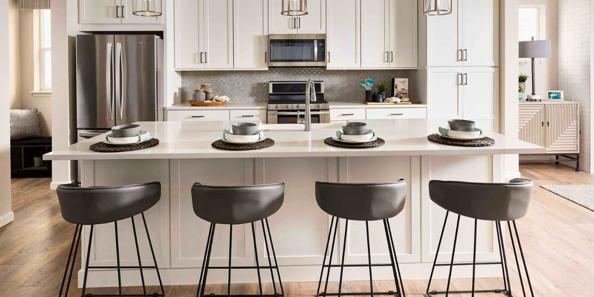 Modern kitchen island with four barstools. 