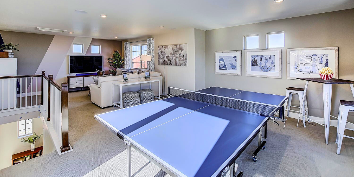 Ping pong table and video game station in a home's flex space. 