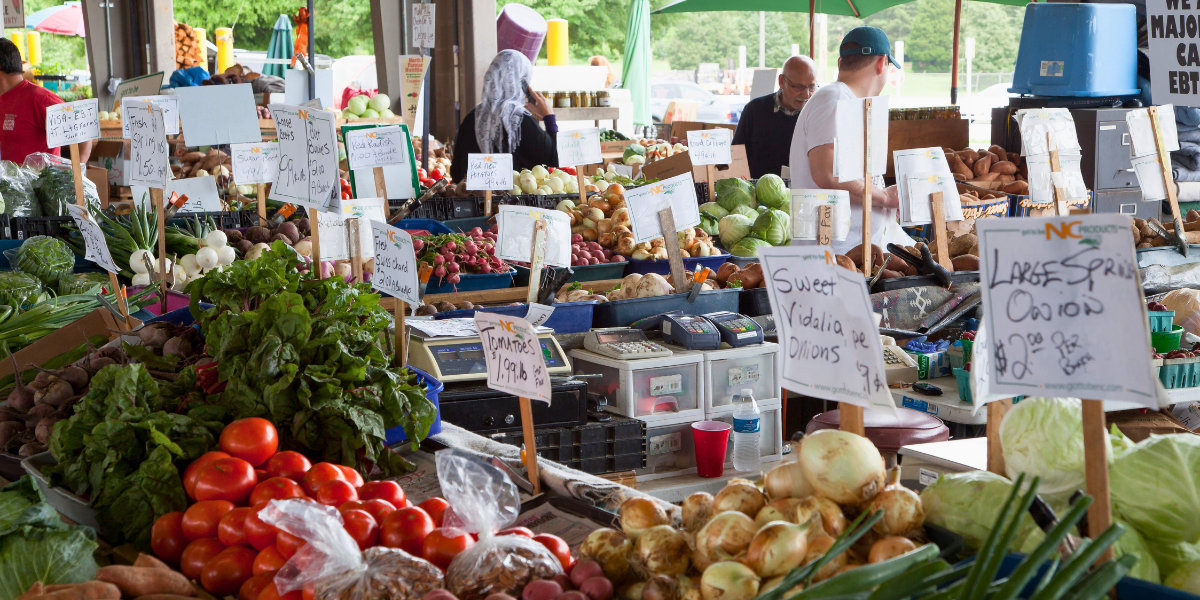 Local farmers' market with fresh goods and produce on display. 