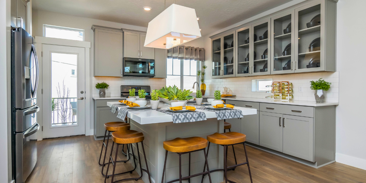 Modern kitchen with sleek kitchen island and open layout in an Oakwood Homes model at Reunion.