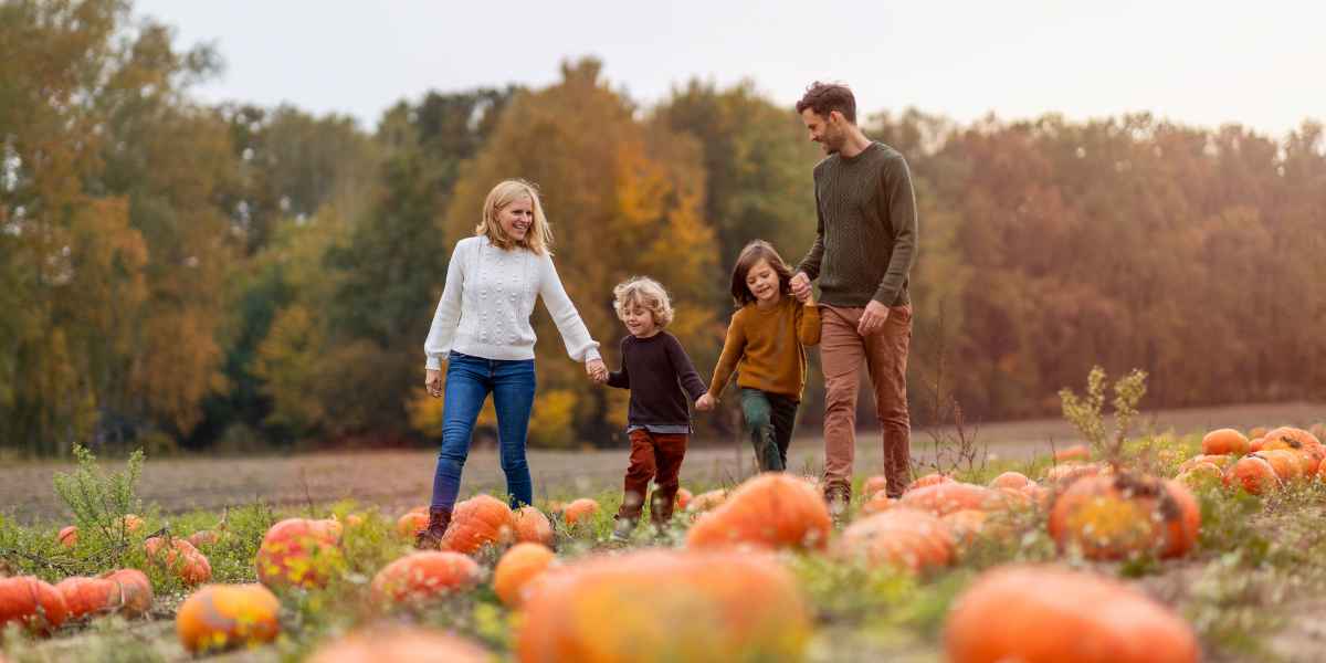 A family at a pumpkin patch.