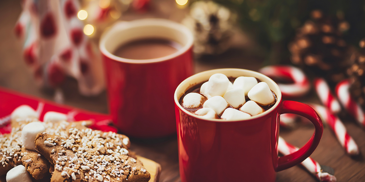Mugs filled with hot chocolate and marshmallows. 